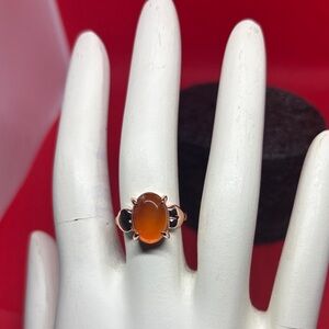 Elegant jadeite cabochon gemstone. Orange and Black Stone Ring